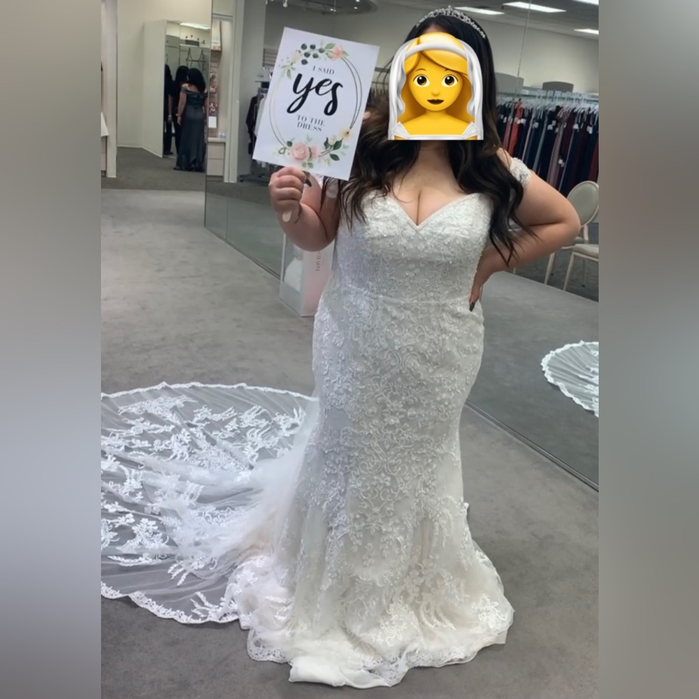 Oleg Cassini off-the-shoulder beaded lace wedding dress.  $750. Originally $1400